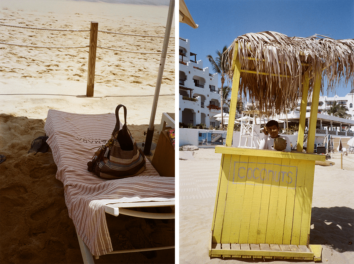 Lounge chair at Tamara beach club and a coconut hut on the beach